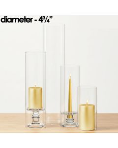Our various Glass Hurricanes Chimney Tubes size options showcased alongside both votive candles or standard taper candles atop our glass candle holders